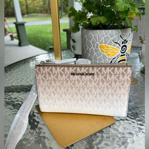 Michael Kors Handbags - NWT-Michael Kors Cream and Tan Wristlet Jet set Travel